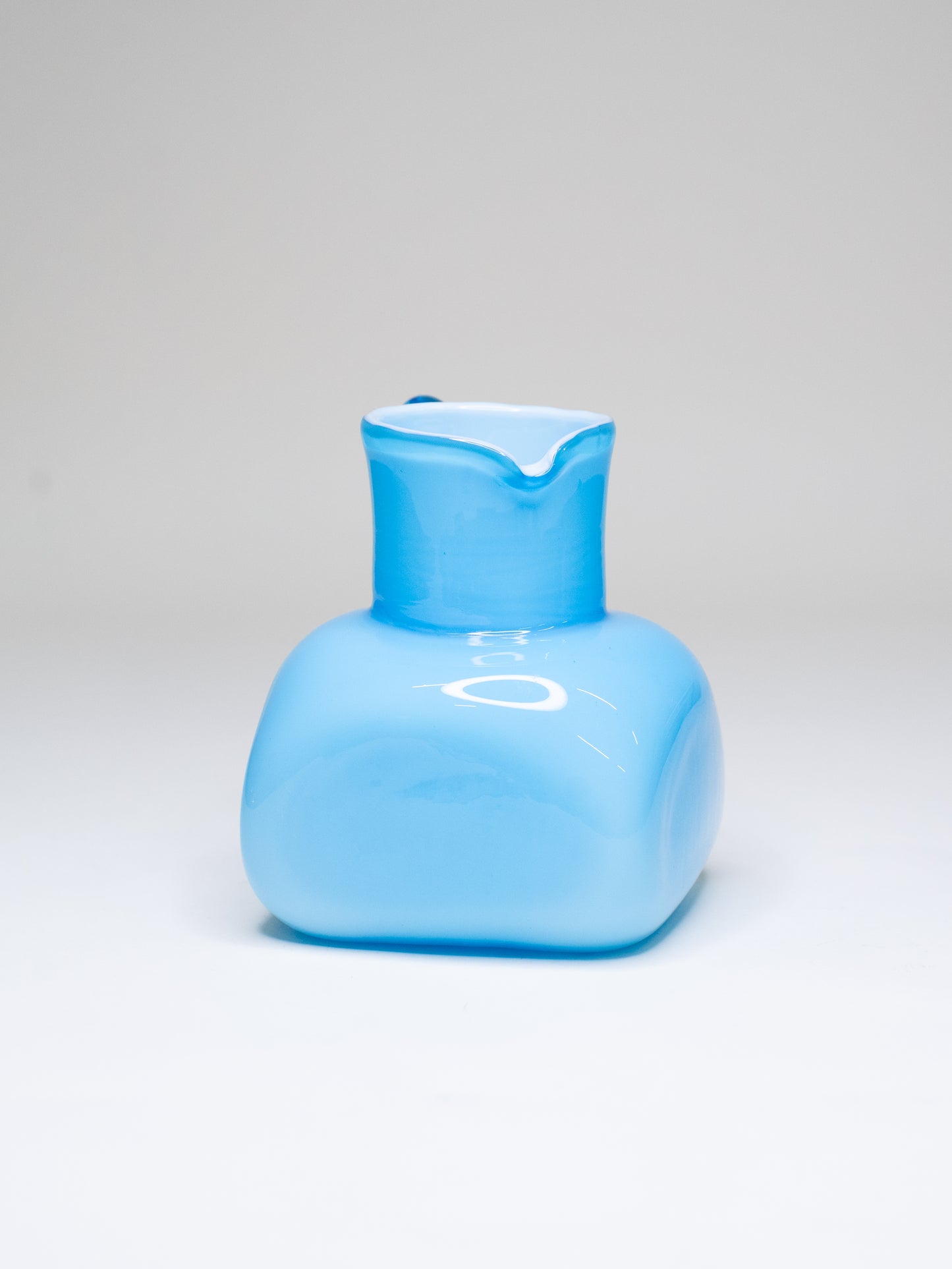 Vintage Blue Cased Glass Pitcher with Chunky Form