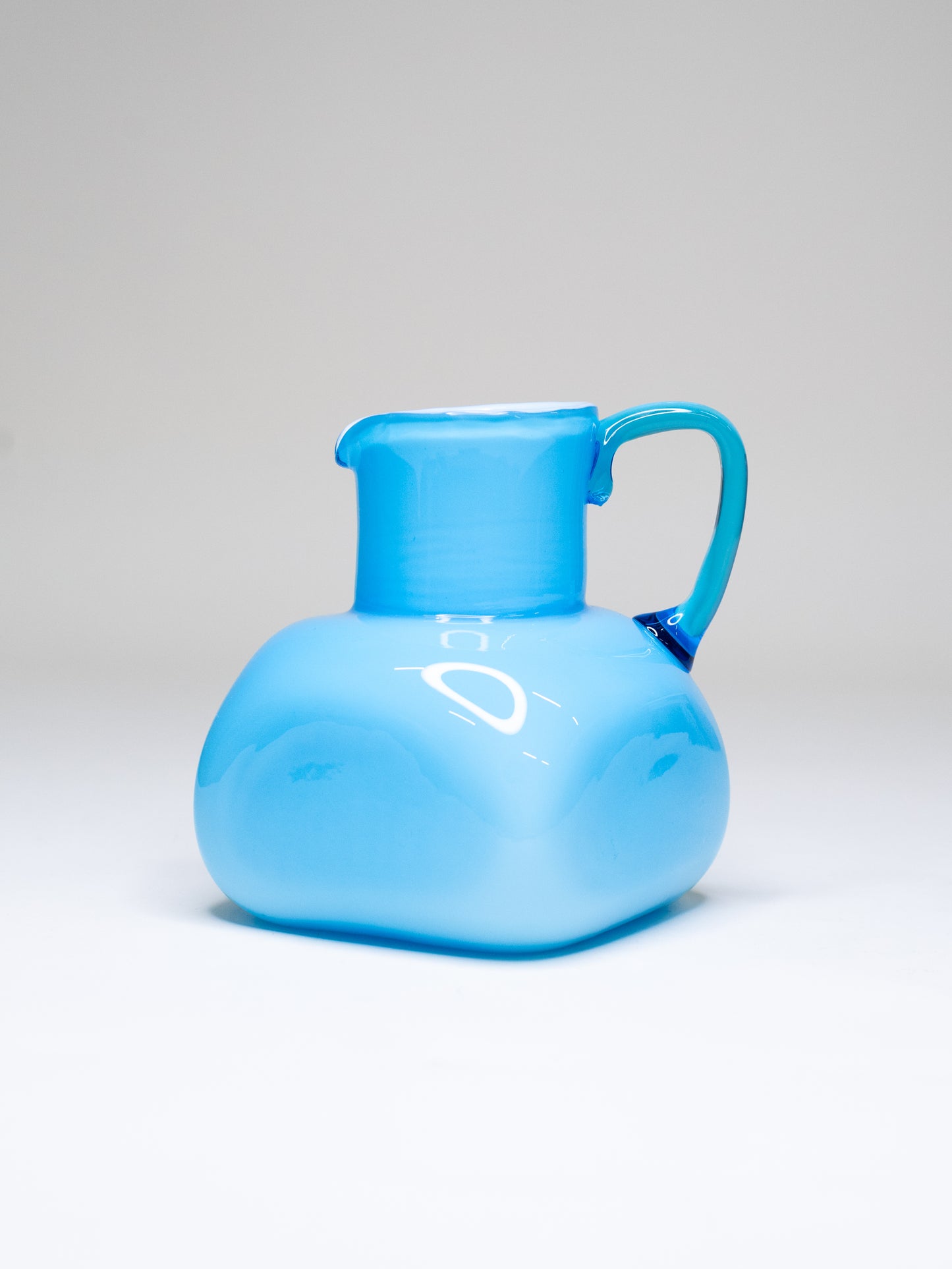Vintage Blue Cased Glass Pitcher with Chunky Form