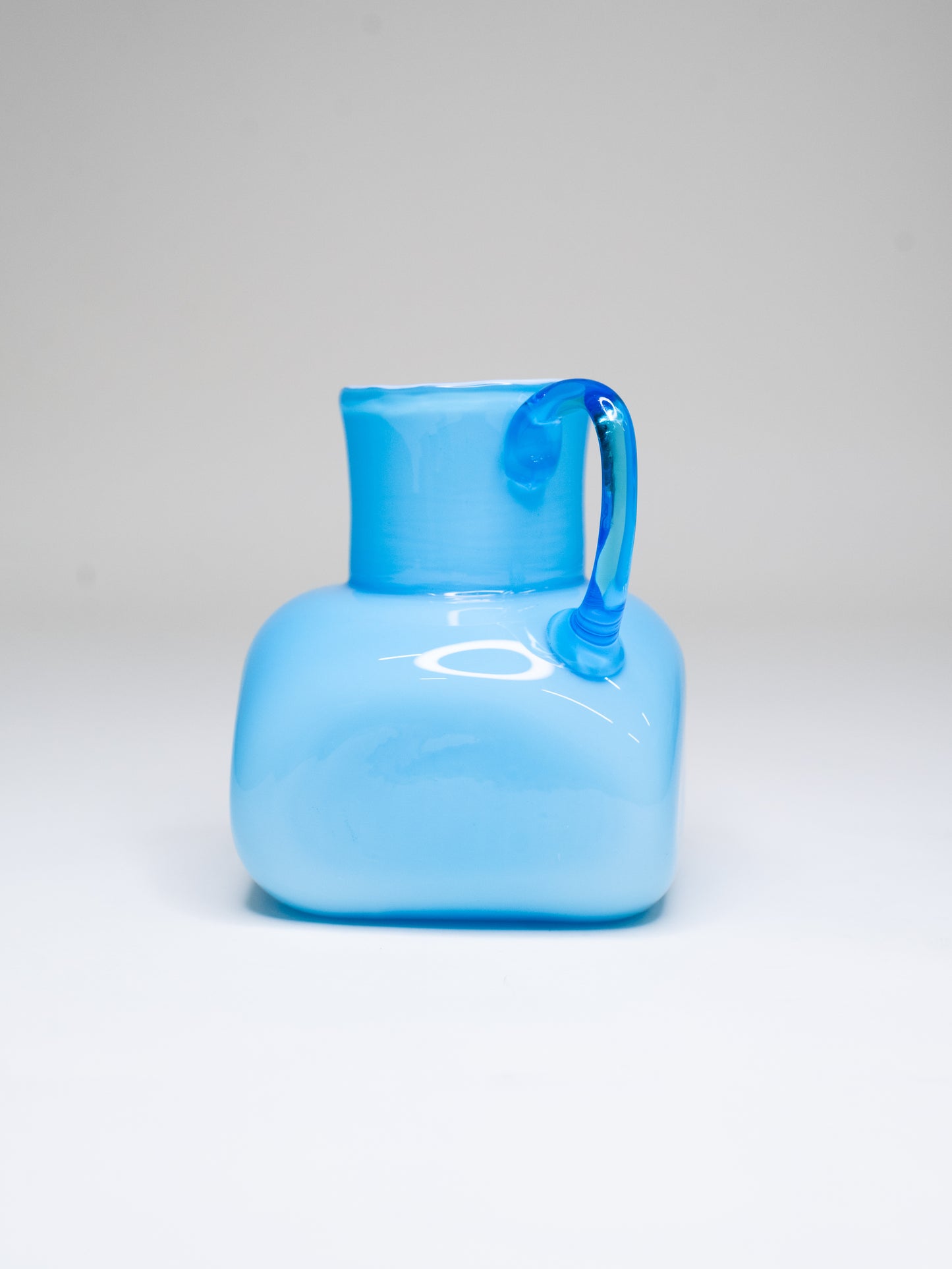 Vintage Blue Cased Glass Pitcher with Chunky Form