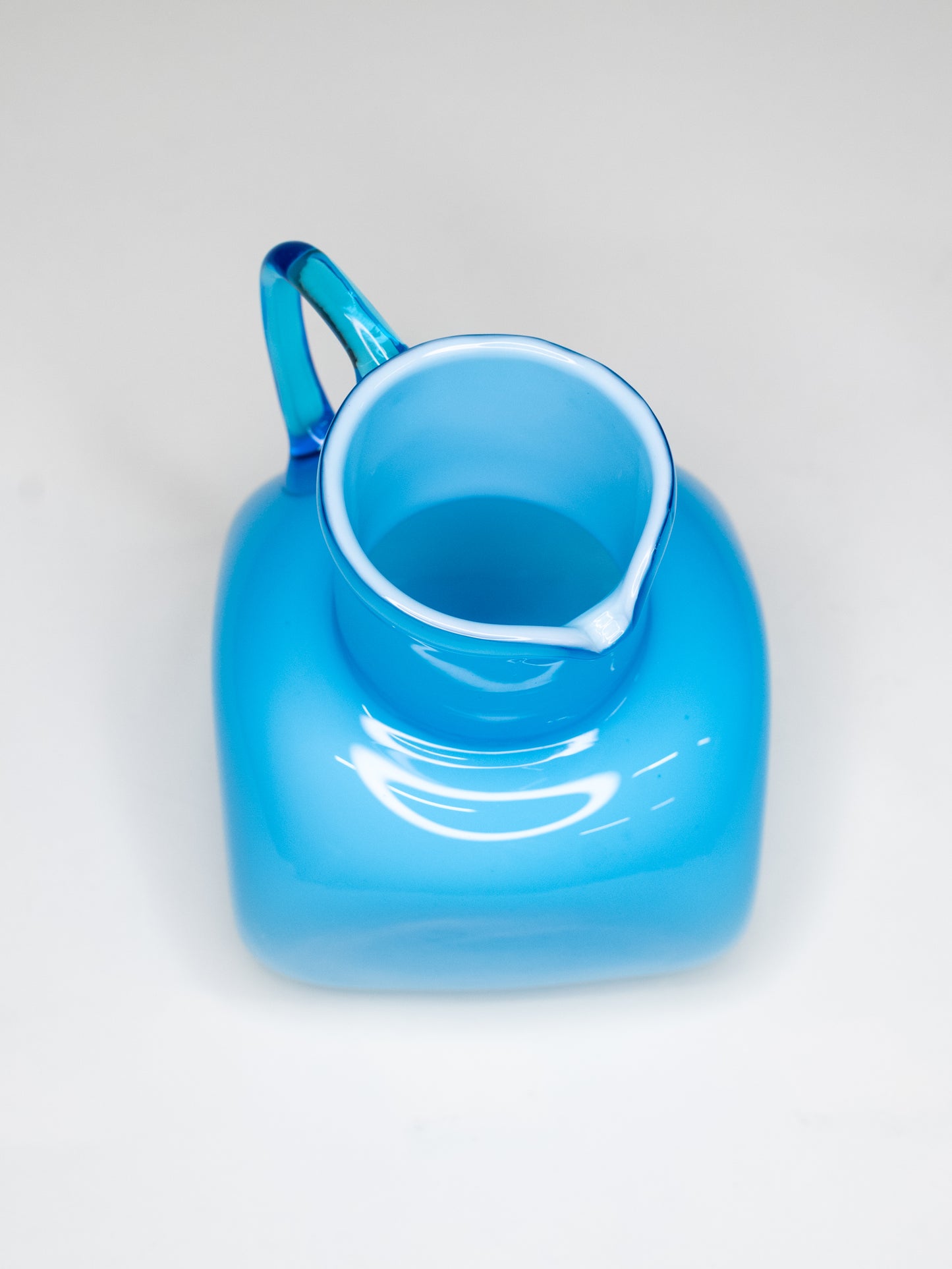 Vintage Blue Cased Glass Pitcher with Chunky Form