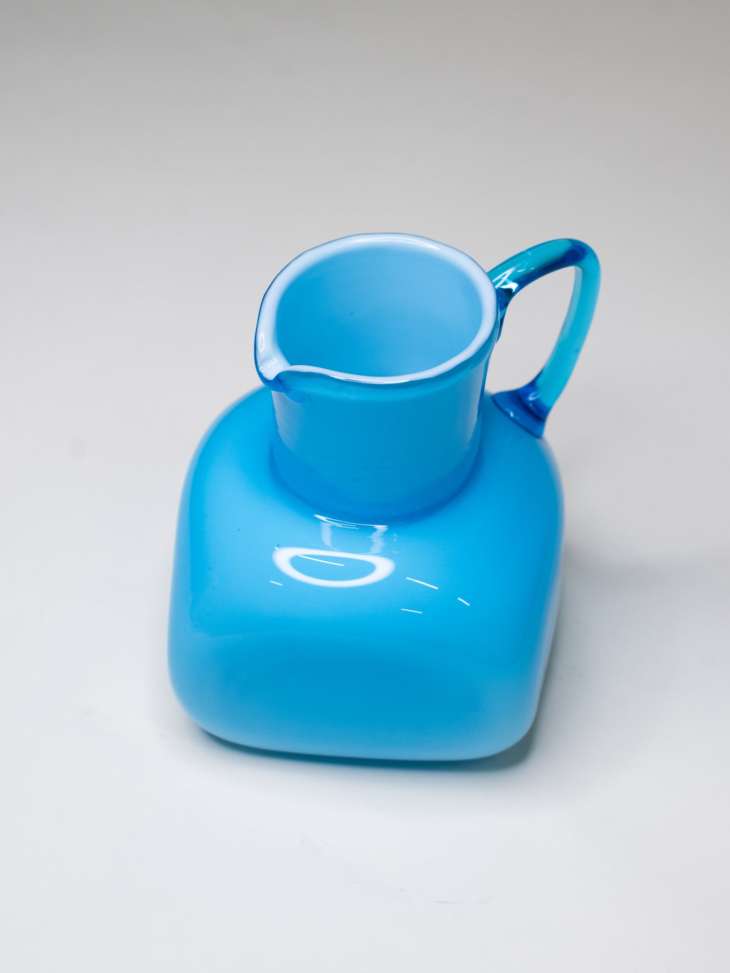 Vintage Blue Cased Glass Pitcher with Chunky Form