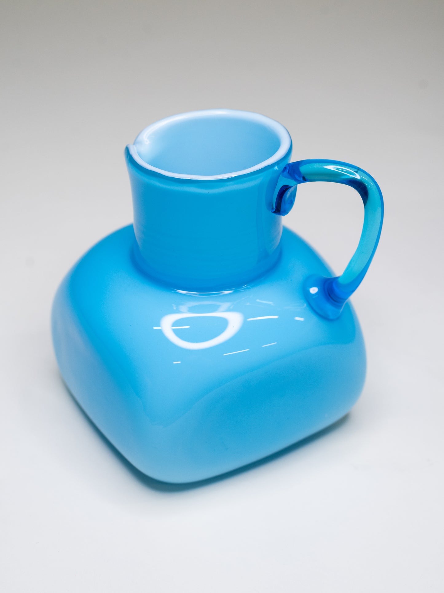 Vintage Blue Cased Glass Pitcher with Chunky Form